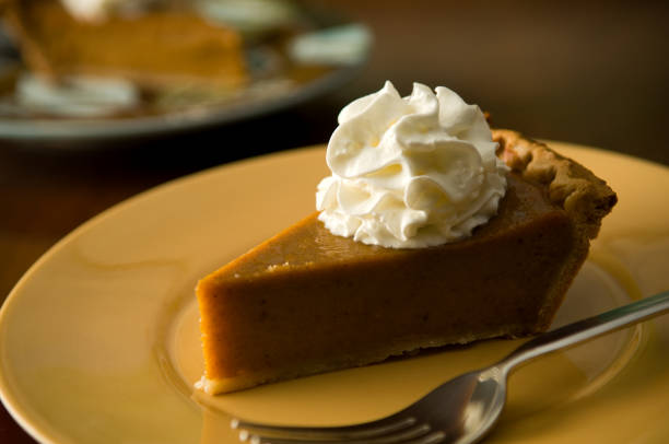 istock Slice of Pumpkin Pie on Orange Plate with Fork 111952145