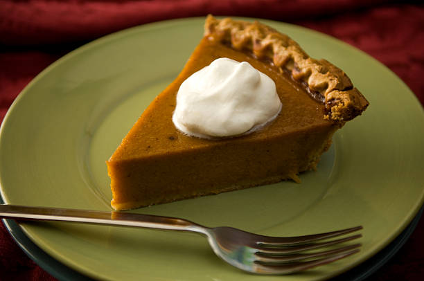 istock Slice of Pumpkin Pie with Whipped Cream Fork Green Plate 111952165