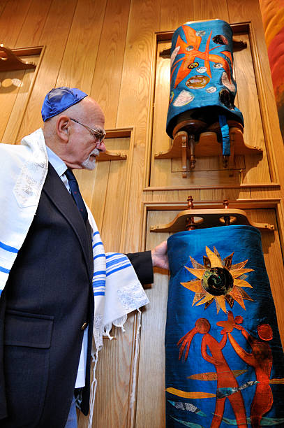 Jewish Rabbi Inspects Torahs stock photo