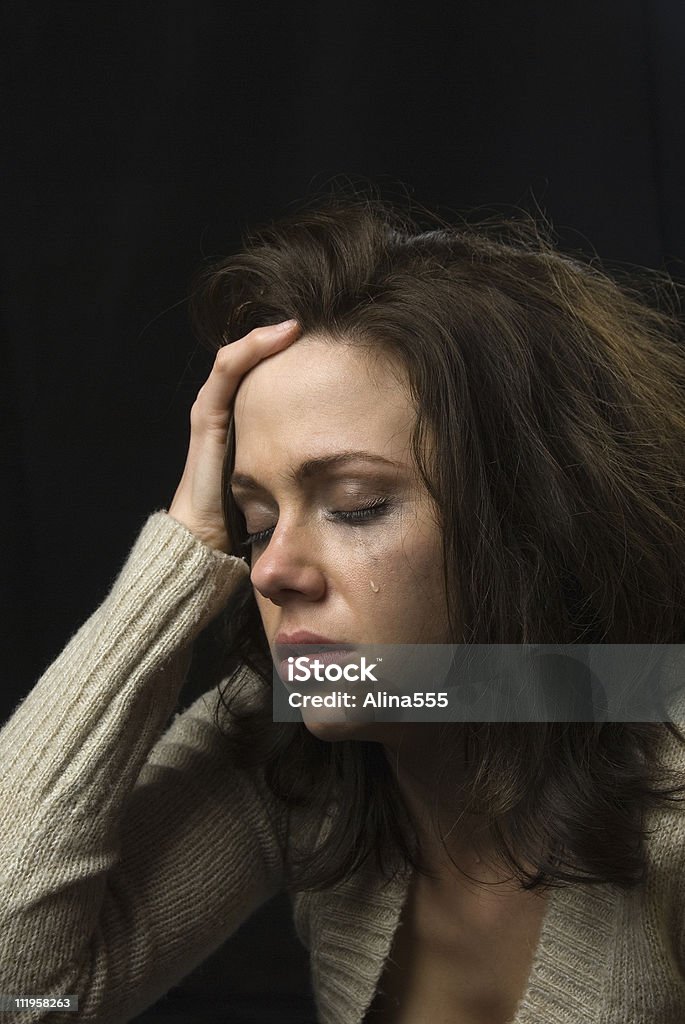 Triste cara de mujer con maquillaje y smeared lágrimas - Foto de stock de Llorar libre de derechos