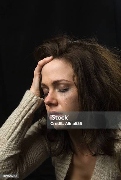 Triste Cara De Mujer Con Maquillaje Y Smeared Lágrimas Foto de stock y más banco de imágenes de Llorar