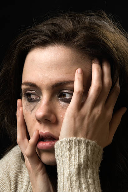 istock Sad woman's face with tears and smeared makeup 111958272