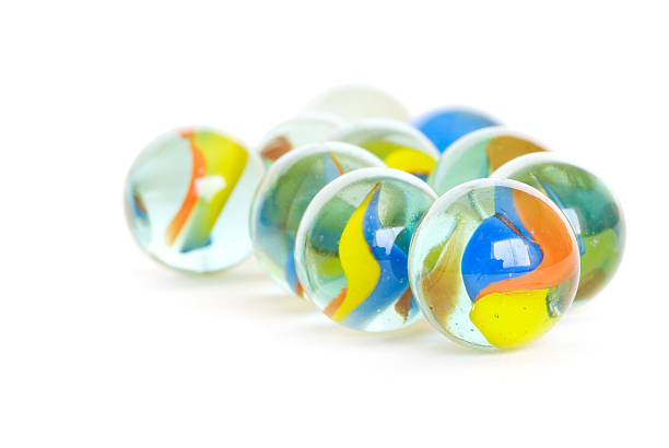 Marbles on white  leasure games stock pictures, royalty-free photos & images