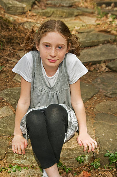 istock girl sitting on stone steps 111961587
