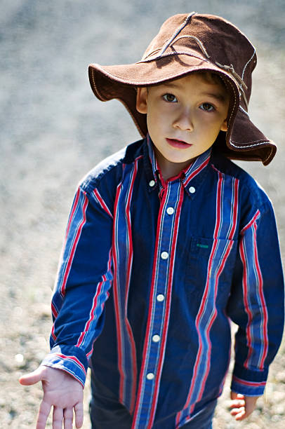 istock little boy in big brown sunhat 111961888
