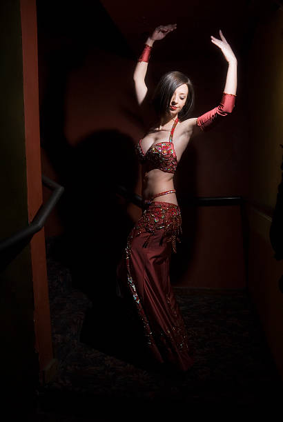 istock Beautiful belly dancer in a dark red room 111962493