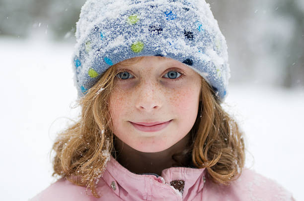 istock tween girl out in the snow 111964729