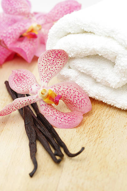 istock Vanilla beans, white towel and orchid flower 111973122