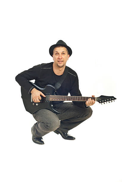 istock Mid adult man playing guitar 111974317