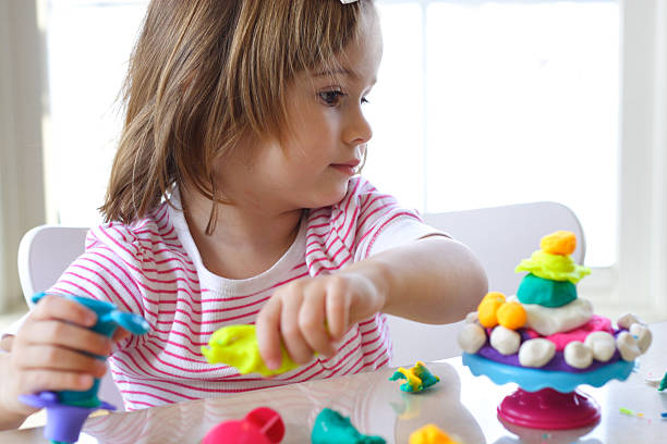 istock Girl playing with play dough 111978852