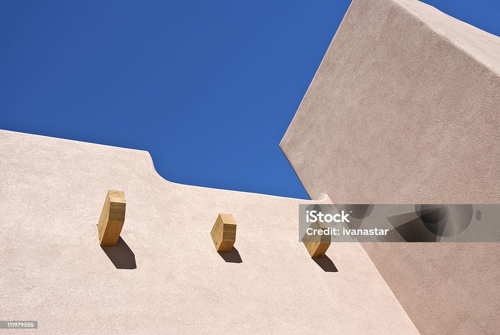 Southwest Santa Fe Adobe Stucco Building with Wooden Roof Beams  Adobe - Material Stock Photo