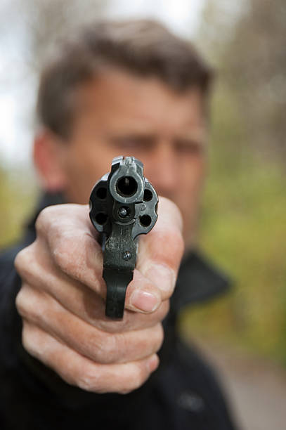 istock The man aims from revolver 112038089