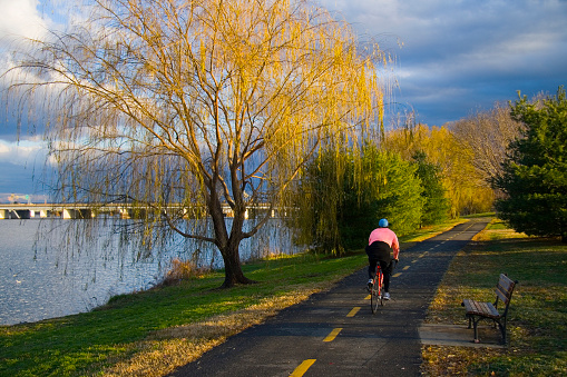 Cyclist on a bike path by the Potomac River in Washington, D.C.