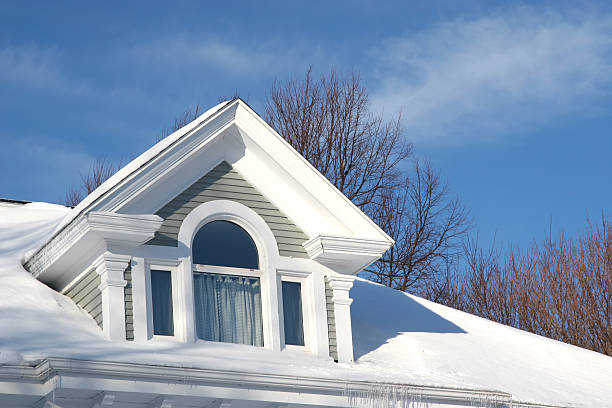 A single family home on Cape Cod after a light February snow storm