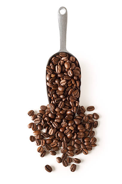 istock Spoonful of coffee beans on white service 112101511