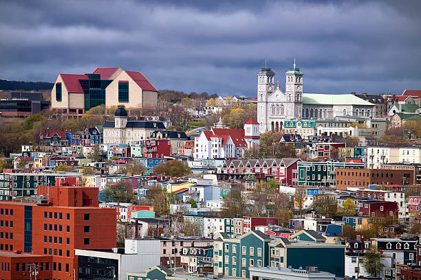 A view of St Johns, Newfoundland The colorful old city of St. John's, Newfoundland with its unique architecture.  The large building on the top left is the new art gallery and museum called 'The Rooms'. newfoundland and labrador photos stock pictures, royalty-free photos & images