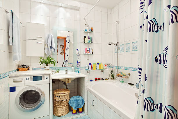 Modern small bathroom in blue colors wide angle view stock photo