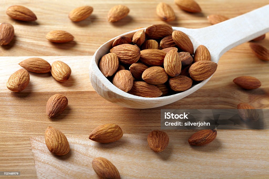 Almonds on wooden background  Almond Stock Photo
