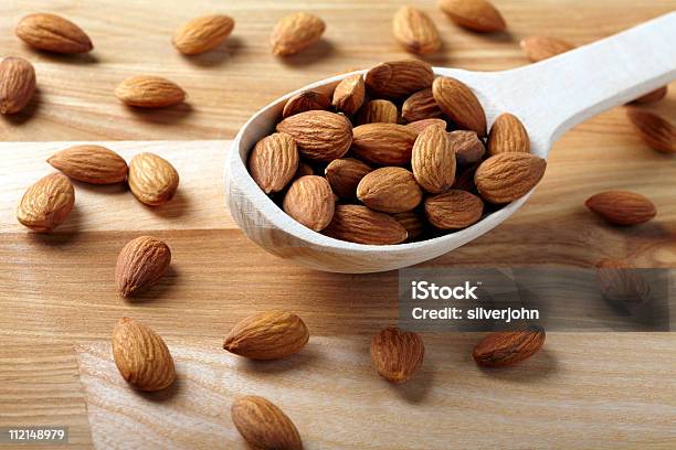 Almonds On Wooden Background Stock Photo - Download Image Now - Almond, Color Image, Food