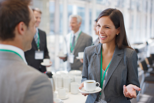 istock Businesswoman drinking coffee and talking to co-worker 112156352