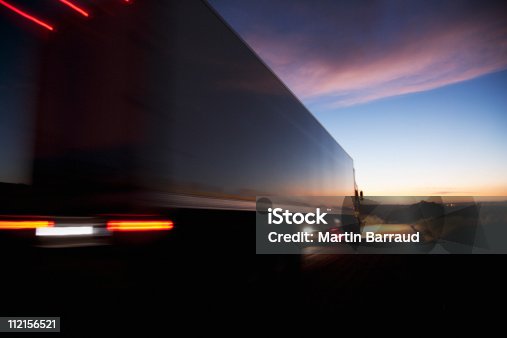 istock Semi-truck speeding on remote road 112156521