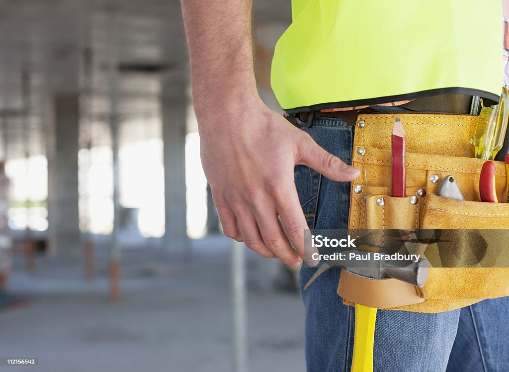 Detalhe do cinto de ferramentas de construção de trabalhadores de construção site - Foto de stock de 20-24 Anos royalty-free