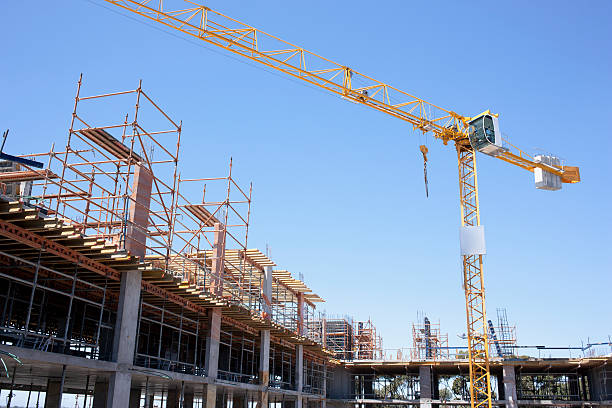 Crane on construction site  crane stock pictures, royalty-free photos & images