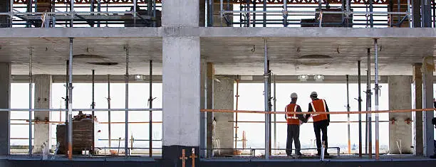 Photo of Construction workers standing together on construction site