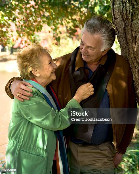 Happy Senior Couple Smiling In The Park Stock Photo - Download Image Now - Active Lifestyle, Active Seniors, Activity