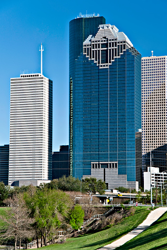 Aerial view of skyscrapers in downtown Houston against cloudy sky, Texas, USA.