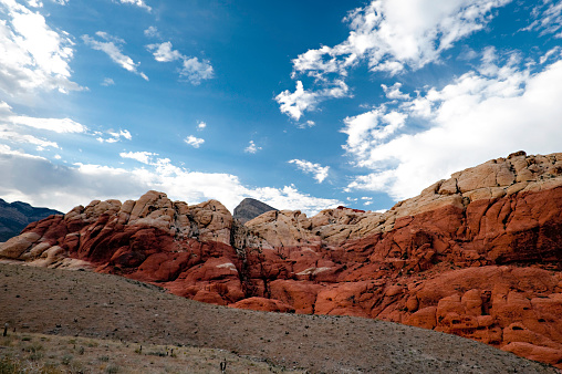 Panorama of the terracotta rocks of Rainbow mountains in Zhangye Danxia National Geopark, Gansu Province, China. Blue sky with copy space