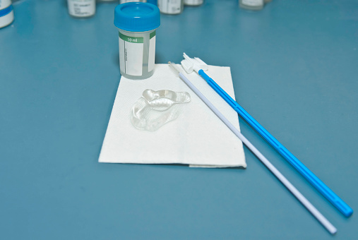 Close up of syringes, gloves, masks and other medical stuff on the desk at hospital