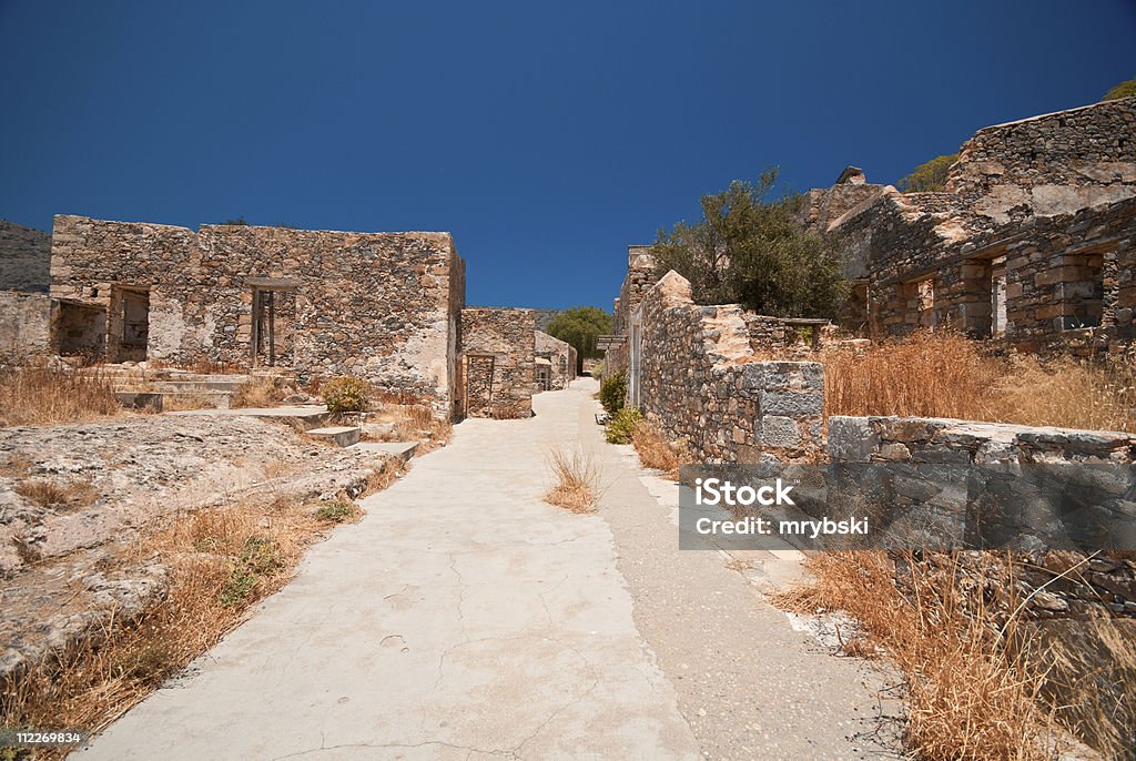 Ruins in Spinalonga Somewhere in Spinalonga, Creete. The island has been used as a leper colony.  Abandoned Stock Photo