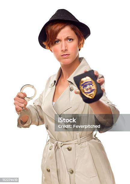 Red Haired Female Detective With Handcuffs And Badge In Trenchco Stock Photo - Download Image Now