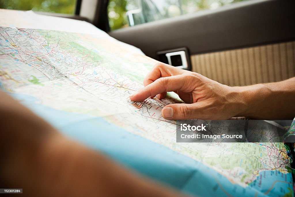 Person with a map  Map Stock Photo