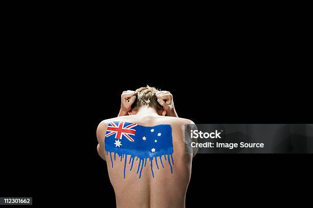 Man With Australian Flag Painted On Back Head In Hands Stock Photo - Download Image Now