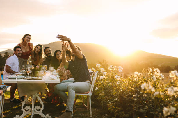 istock Group selfie at outdoor dinner party 1124220610