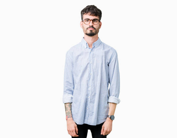 istock Young handsome man wearing glasses over isolated background with serious expression on face. Simple and natural looking at the camera. 1124221591
