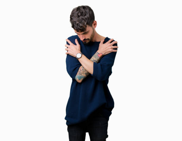 istock Young handsome man over isolated background Hugging oneself happy and positive, smiling confident. Self love and self care 1124221949