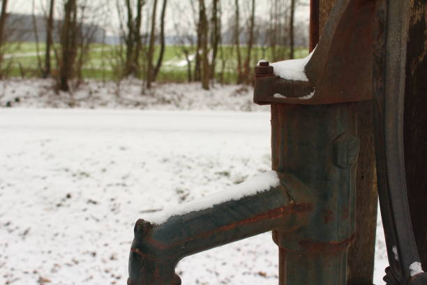 istock Snow on the water pump 1124222925