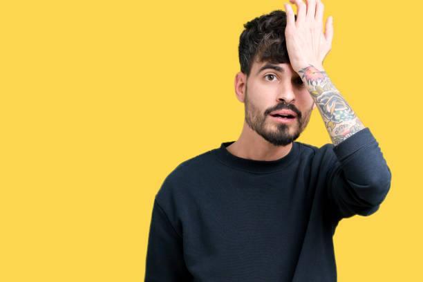 istock Young handsome man over isolated background surprised with hand on head for mistake, remember error. Forgot, bad memory concept. 1124223608