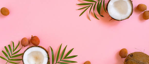 istock Pink tropical banner with coconut and palm leaves 1124223619