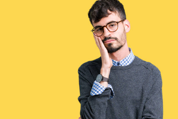 istock Young handsome smart man wearing glasses over isolated background thinking looking tired and bored with depression problems with crossed arms. 1124223734