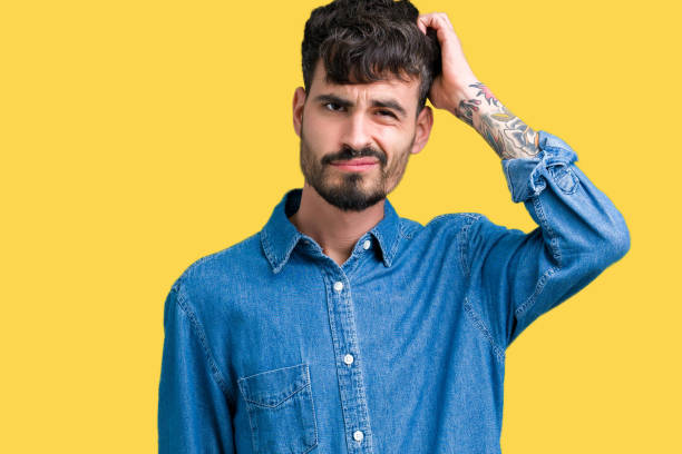 istock Young handsome man over isolated background confuse and wonder about question. Uncertain with doubt, thinking with hand on head. Pensive concept. 1124224029