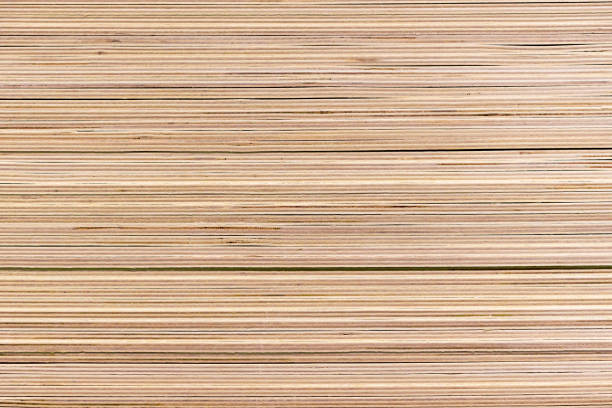 Piled sheets of plywood in a building materials store. Piled sheets of plywood in a building materials store. plywood stock pictures, royalty-free photos & images