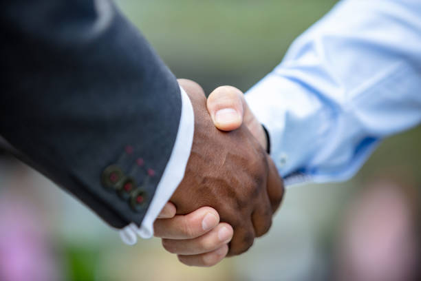 istock Close-up of men shaking hands 1124225702