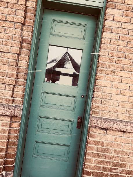 Green door in snowfall