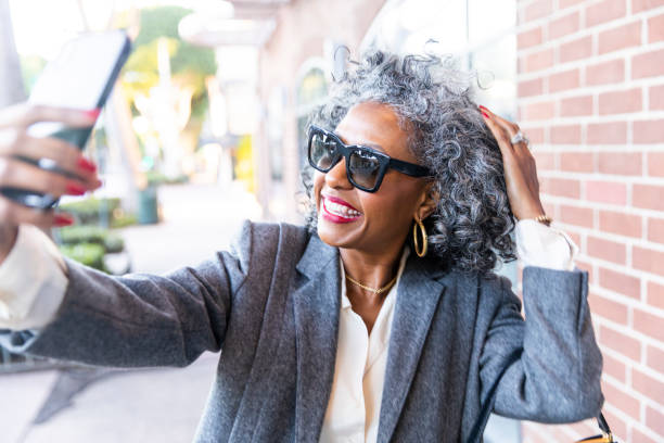 istock Black Woman Taking Selfie after Work 1124226286
