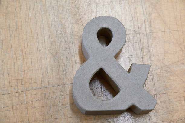 istock Ampersand Symbol  lying on scratched table 1124226302