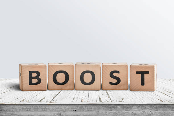 istock Boost sign on a wooden table in a bright room 1124226824